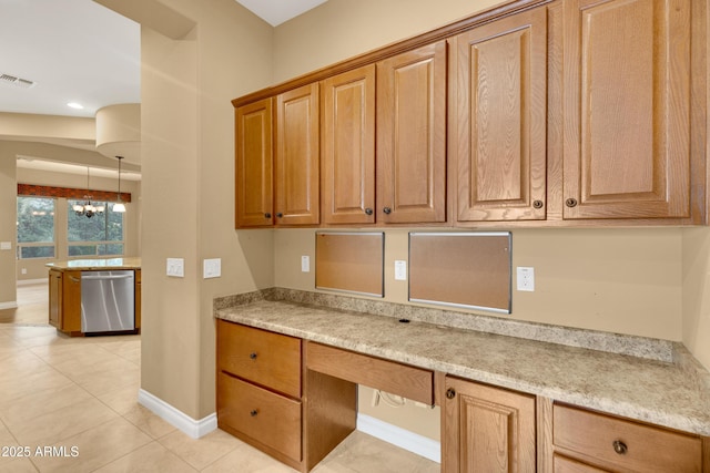 1620 E Sattoo Way, Queen Creek, AZ 85140 - kitchen with stainless steel dishwasher, baseboards, light tile patterned floors, a chandelier, and brown cabinets
