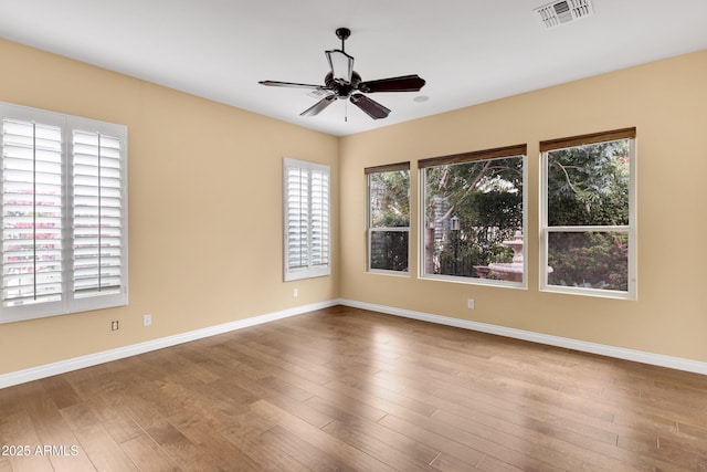 1620 E Sattoo Way, Queen Creek, AZ 85140 - spare room featuring ceiling fan, wood finished floors, and baseboards