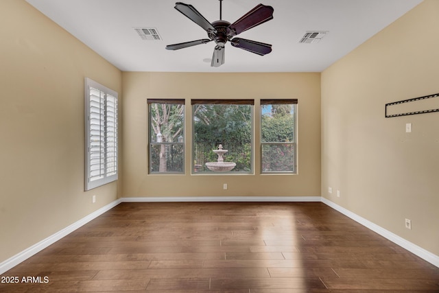 1620 E Sattoo Way, Queen Creek, AZ 85140 - spare room featuring ceiling fan, dark wood-style flooring, and baseboards