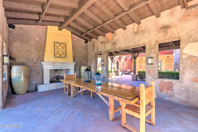 1620 E Sattoo Way, Queen Creek, AZ 85140 - dining space featuring stone tile flooring, high vaulted ceiling, a tile fireplace, beam ceiling, and wood ceiling