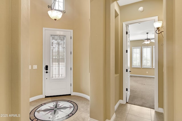 1620 E Sattoo Way, Queen Creek, AZ 85140 - entryway featuring light tile patterned floors, baseboards, and a ceiling fan
