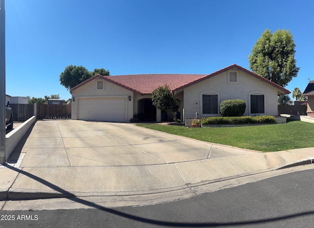 930 N Sandal Cir, Mesa, AZ 85205 - view of front of home featuring a tiled roof, stucco siding, an attached garage, and concrete driveway
