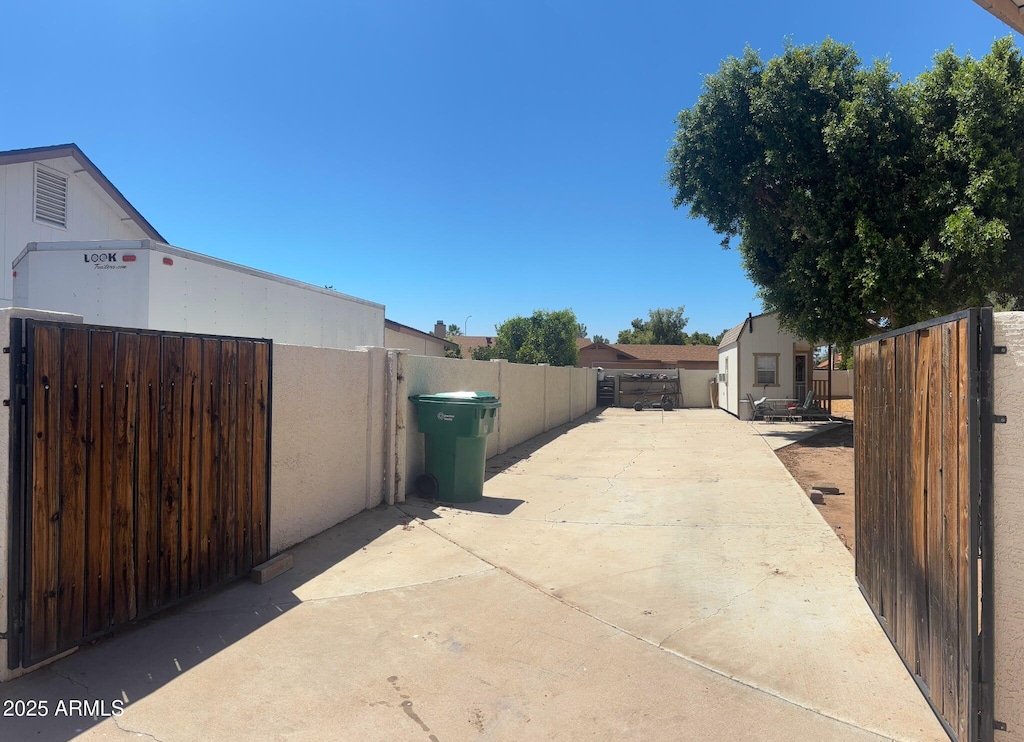 930 N Sandal Cir, Mesa, AZ 85205 - view of concrete driveway with a gate