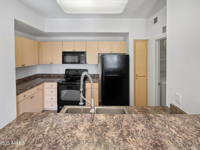 kitchen with black appliances, light brown cabinets, and sink