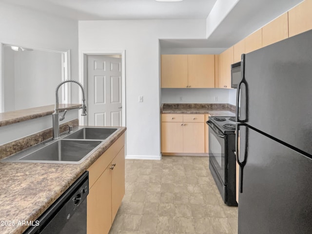 kitchen with light brown cabinetry, sink, and black appliances