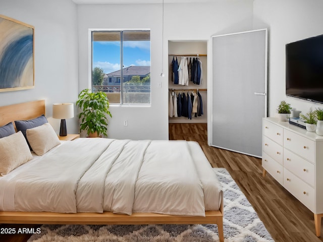 bedroom featuring dark wood-type flooring