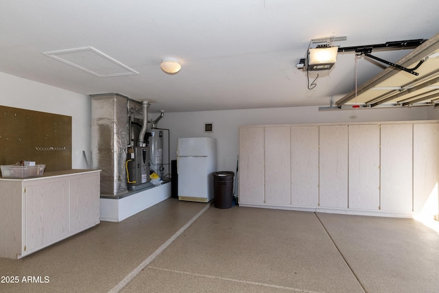 garage with a garage door opener, gas water heater, and white fridge