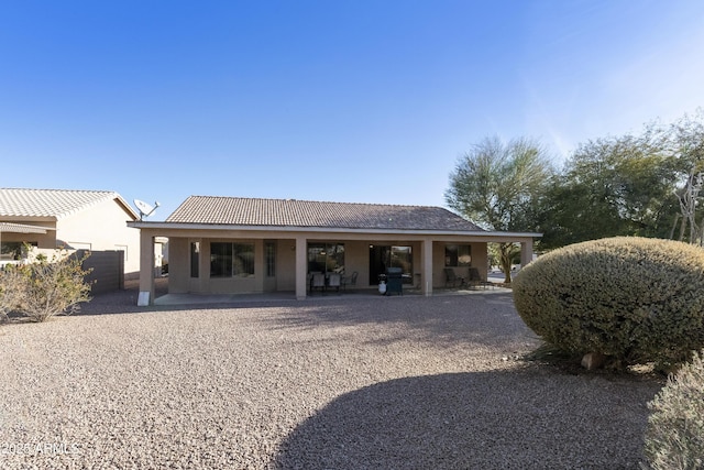 back of house featuring a patio