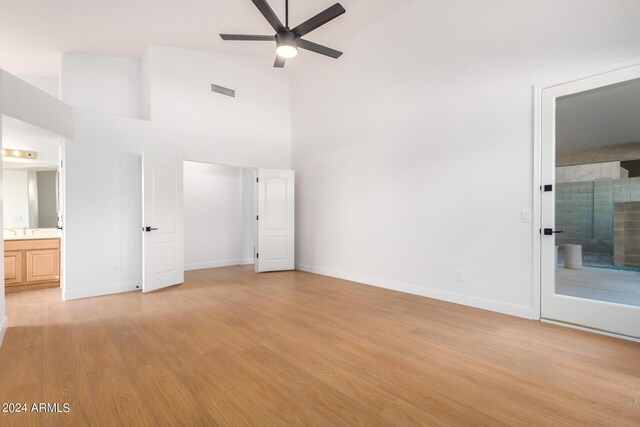 empty room with ceiling fan and dark hardwood / wood-style flooring