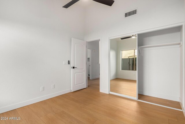 empty room featuring lofted ceiling, light hardwood / wood-style flooring, and ceiling fan