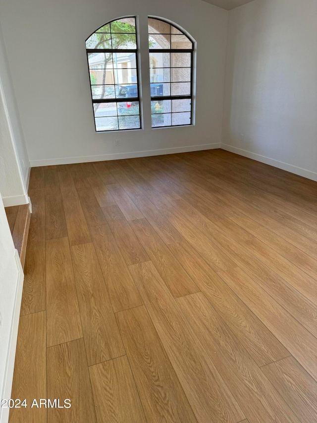 spare room featuring light hardwood / wood-style flooring