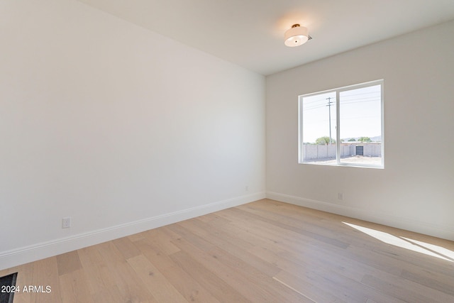 empty room with light wood-type flooring