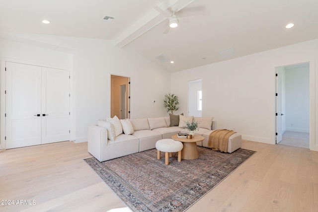 living room featuring light wood-type flooring, lofted ceiling with beams, and ceiling fan