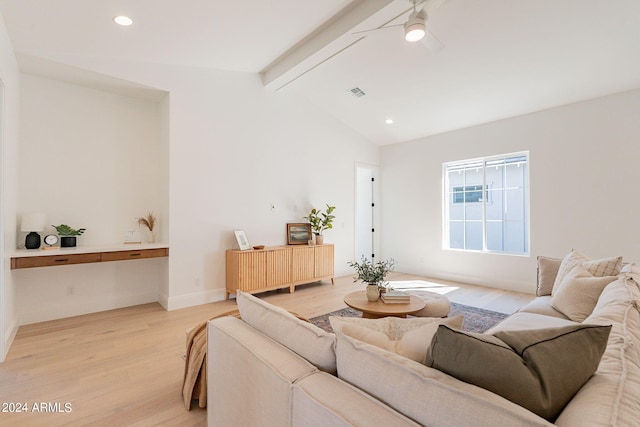 living room with ceiling fan, vaulted ceiling with beams, and light hardwood / wood-style floors