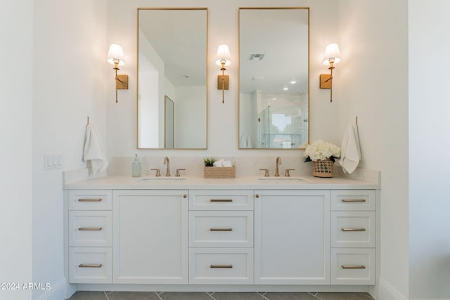 bathroom featuring vanity, tile patterned flooring, and an enclosed shower