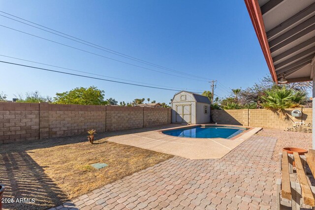 1316 N Spring Cir, Mesa, AZ 85203 - view of swimming pool featuring an outbuilding, a patio, a shed, and a fenced backyard