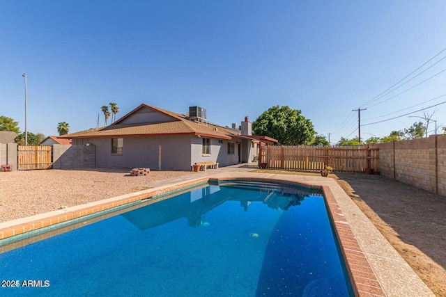 1316 N Spring Cir, Mesa, AZ 85203 - view of swimming pool with a fenced backyard, a fenced in pool, and central AC