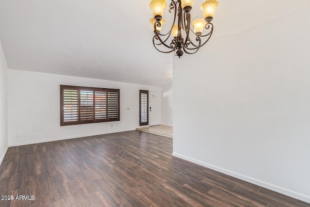 1316 N Spring Cir, Mesa, AZ 85203 - unfurnished living room with lofted ceiling, baseboards, wood finished floors, and an inviting chandelier