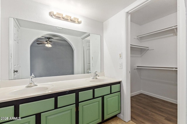1316 N Spring Cir, Mesa, AZ 85203 - full bathroom with double vanity, a ceiling fan, wood finished floors, and a sink