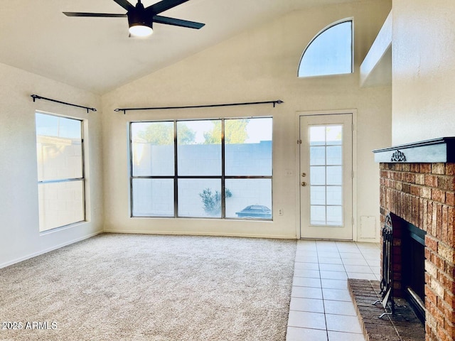 unfurnished living room featuring light tile patterned floors, a ceiling fan, light colored carpet, a brick fireplace, and high vaulted ceiling