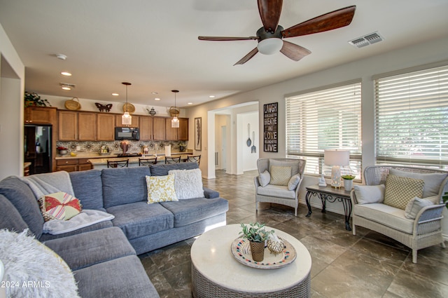 living room featuring ceiling fan