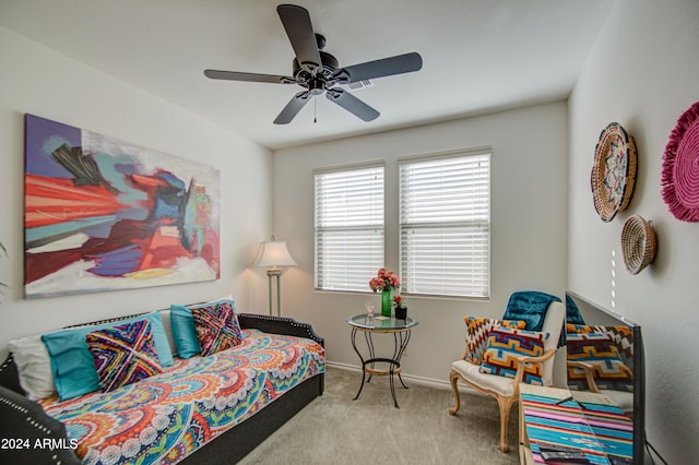 bedroom with ceiling fan and light colored carpet