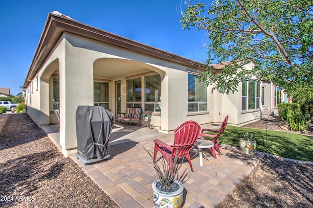 back of property featuring a patio