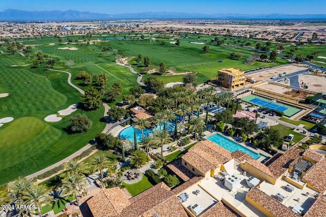 birds eye view of property with a mountain view