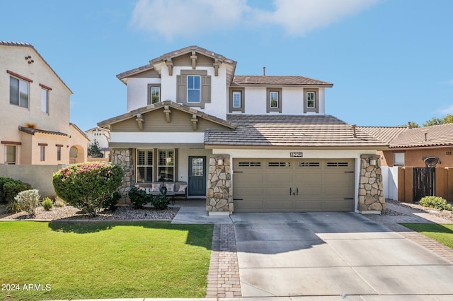 view of front of house with a front yard and a garage