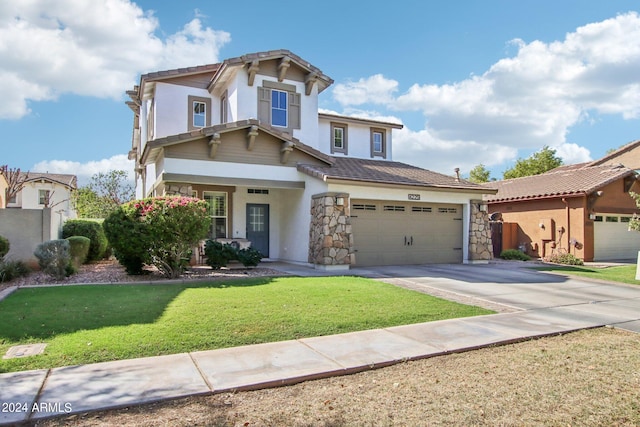 view of front of house featuring a front yard and a garage