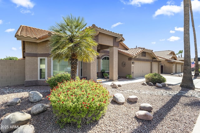 1449 W Sherri Dr, Gilbert, AZ 85233 - view of front facade featuring stucco siding, a garage, a tile roof, and driveway