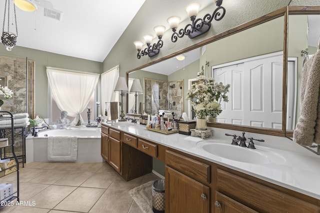 1449 W Sherri Dr, Gilbert, AZ 85233 - full bath with vaulted ceiling, a shower stall, double vanity, a garden tub, and tile patterned floors