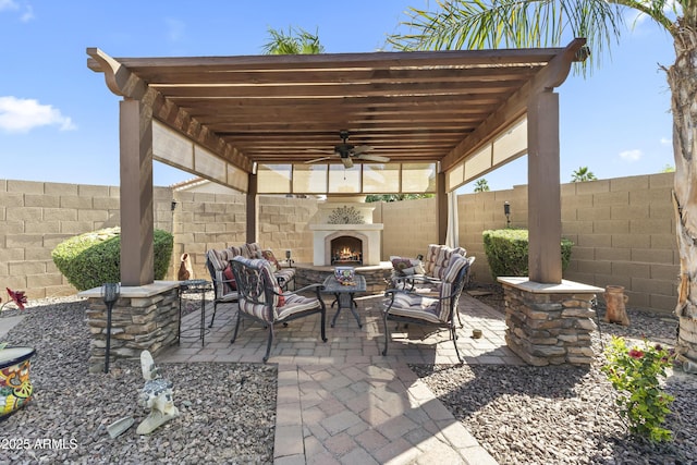 1449 W Sherri Dr, Gilbert, AZ 85233 - fenced backyard featuring a patio area, ceiling fan, and an outdoor living space with a fireplace