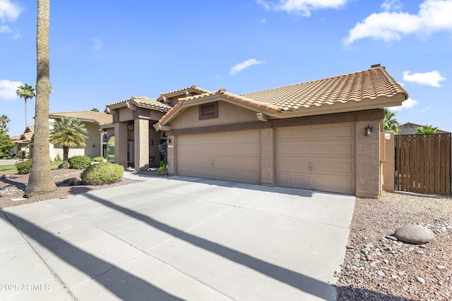 1449 W Sherri Dr, Gilbert, AZ 85233 - view of front facade with stucco siding, an attached garage, concrete driveway, and a tiled roof