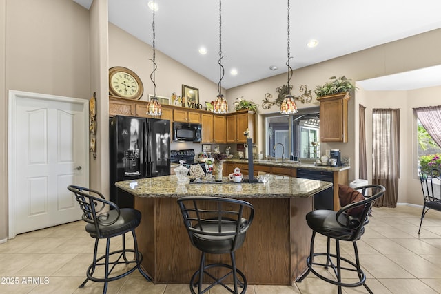 1449 W Sherri Dr, Gilbert, AZ 85233 - kitchen with black appliances, light tile patterned floors, a kitchen island, a breakfast bar, and high vaulted ceiling