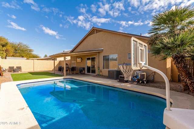 view of pool featuring central AC unit and a patio