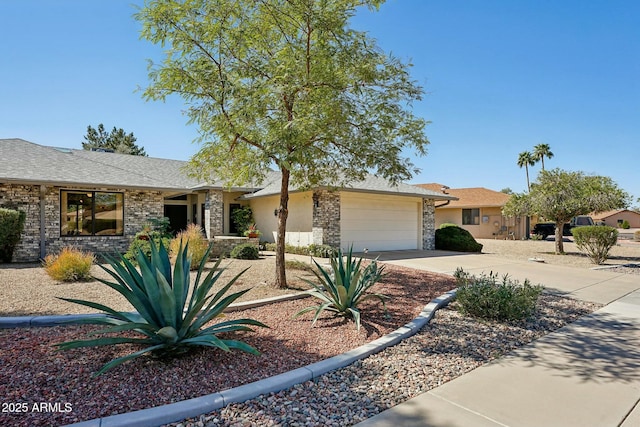 ranch-style home featuring driveway, a garage, and roof with shingles