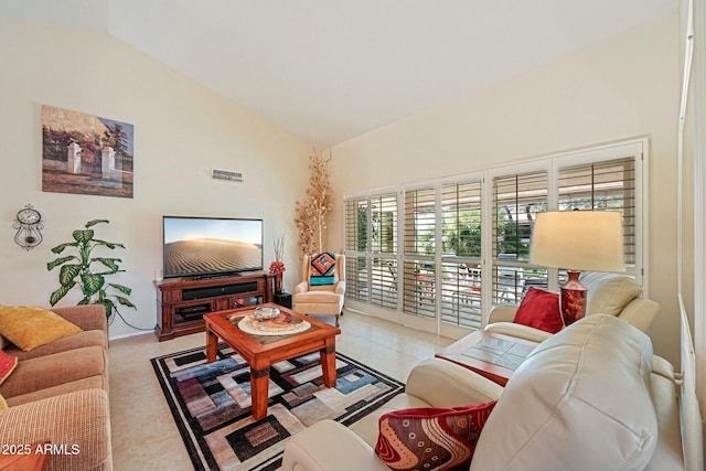 living area featuring high vaulted ceiling