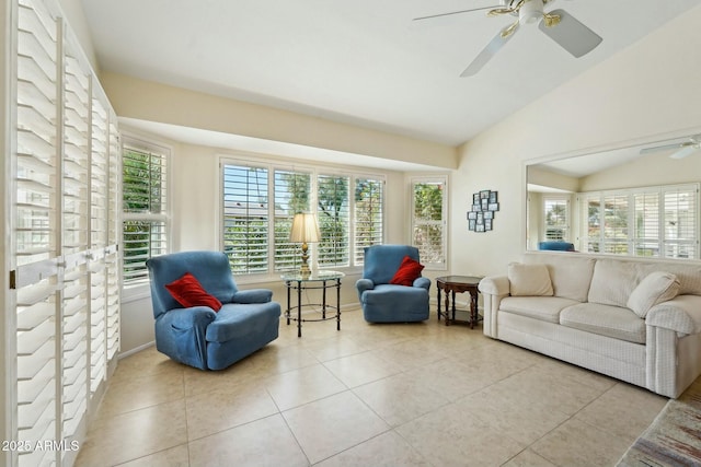 tiled living room featuring vaulted ceiling and ceiling fan