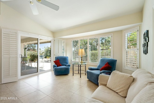 interior space with ceiling fan, tile patterned flooring, and vaulted ceiling