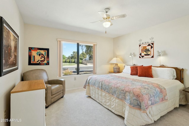 bedroom with light colored carpet, baseboards, and ceiling fan