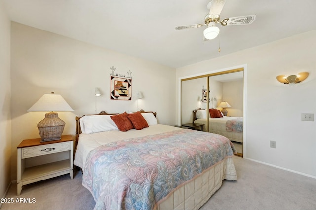 carpeted bedroom featuring baseboards, a closet, and ceiling fan