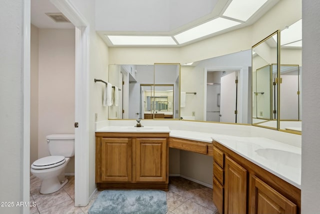 full bathroom featuring tile patterned flooring, visible vents, toilet, a skylight, and a sink