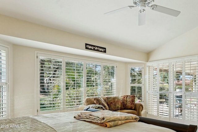 sunroom featuring ceiling fan and lofted ceiling