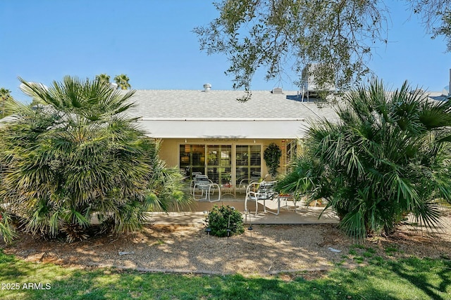 back of property featuring stucco siding and a patio