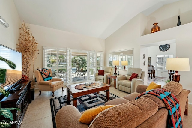 living room featuring light tile patterned floors and high vaulted ceiling