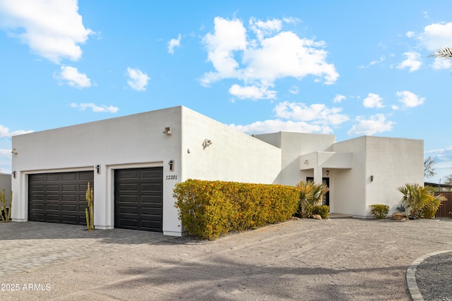 southwest-style home with a garage