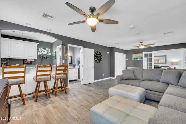 4116 E Downing St, Mesa, AZ 85205 - living room with ceiling fan, light wood-type flooring, recessed lighting, and arched walkways