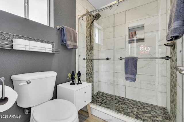 4116 E Downing St, Mesa, AZ 85205 - bathroom with a textured wall and a stall shower