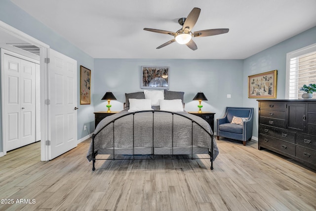 4116 E Downing St, Mesa, AZ 85205 - bedroom with light wood-type flooring and a ceiling fan